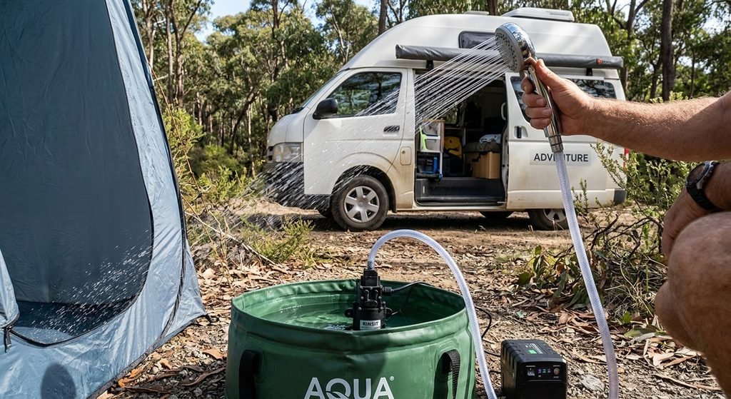 Portable shower pump - an easy van life water setup essential for washing off the dust