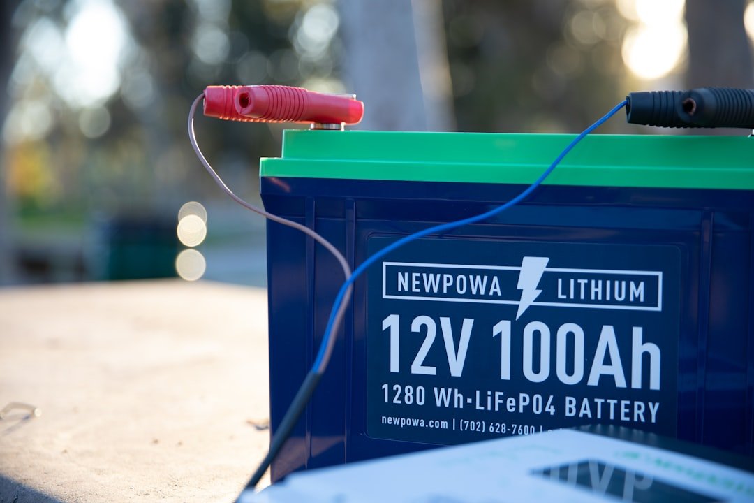 Close-up of a 12V battery and electrical connections